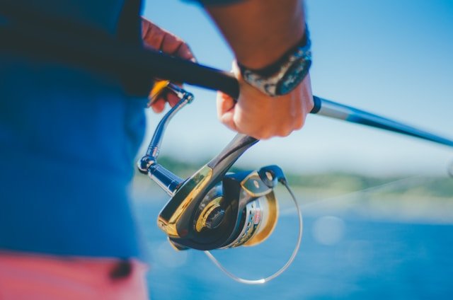 Fisherman casting at golden hour